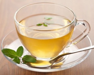 cup of green tea with mint